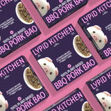 Multiple packages of Lypid Kitchen BBQ Pork Bao on a pink background