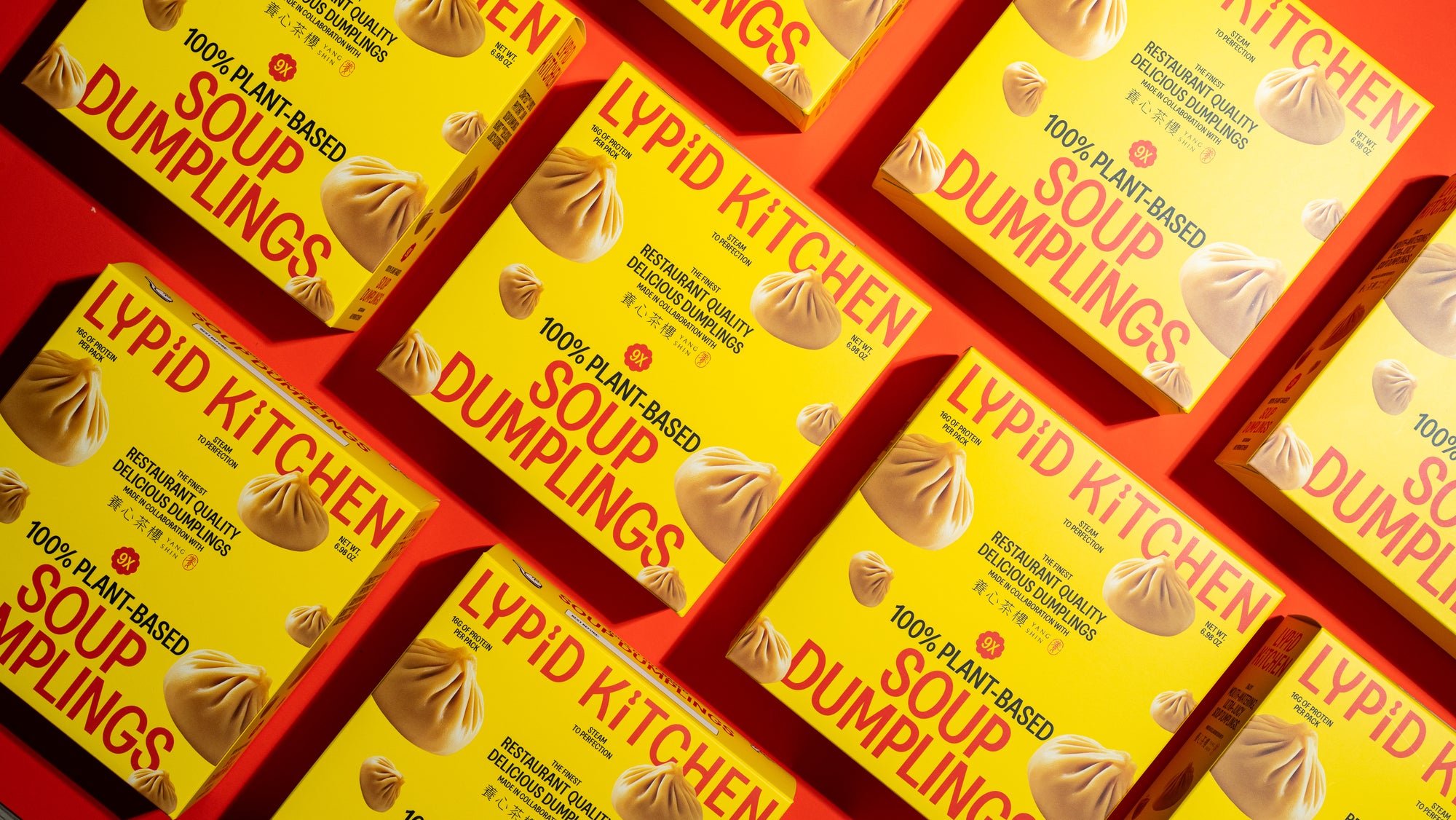 Multiple boxes of Lypid Kitchen soup dumplings on a red background