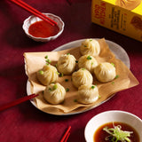 Steamed dumplings are being served.